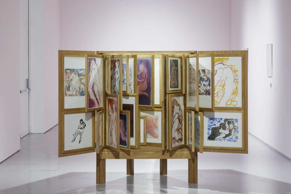 Alex Cecchetti, Erotic Cabinet (2016-2017) 69 works mixed techniques, furniture in solid oak wood, frames, poems disguised as paintings. Installation view, At the Gates of the Music Palace (2018) Spike Island. Photograph by Lisa Whiting
