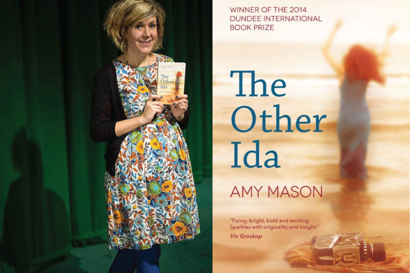 A photograph of the author Amy Mason next to her book The Other Ida.