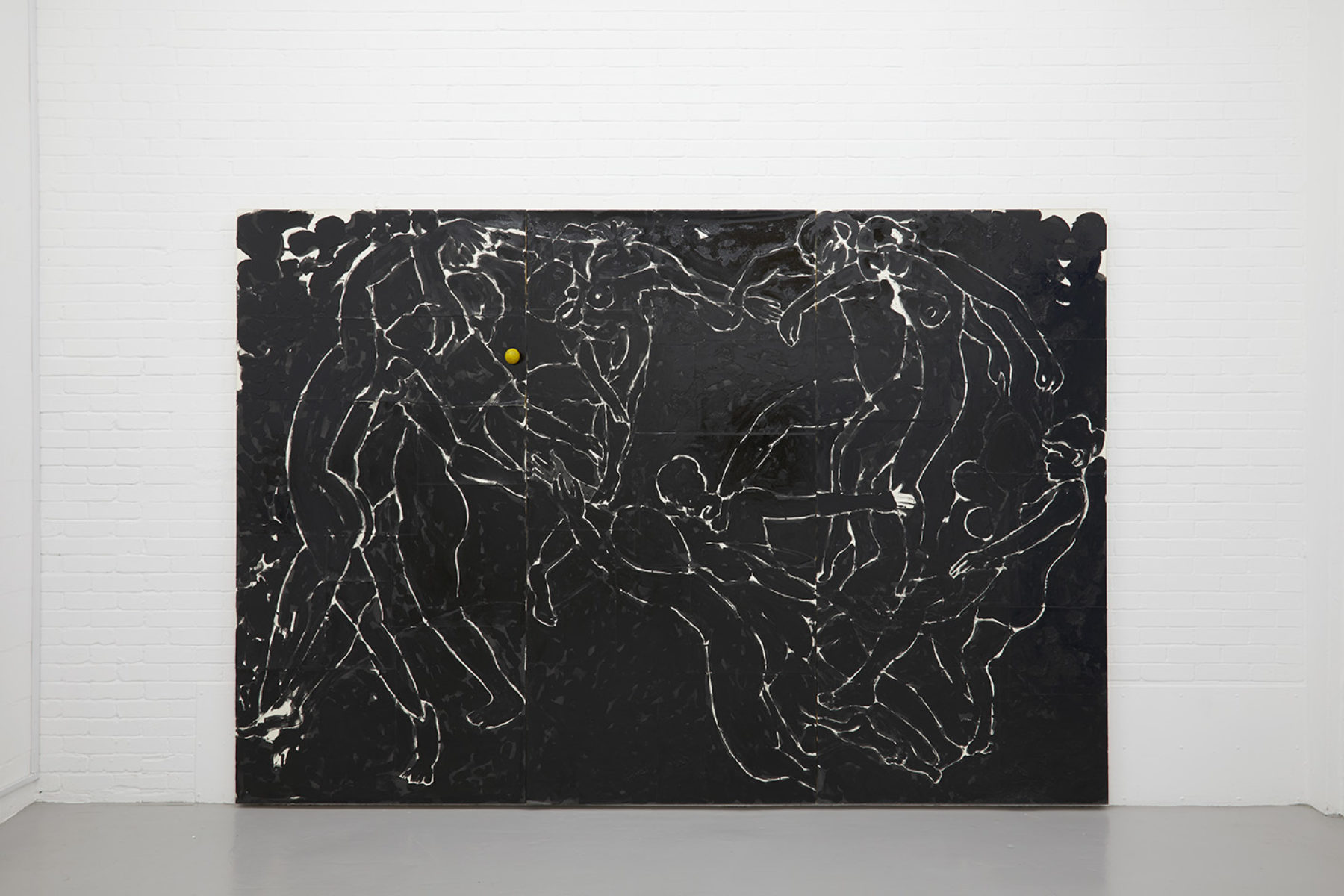 A large black canvas has faint outlines of people in a circle dancing naked. The faint outlines appear in white on black.