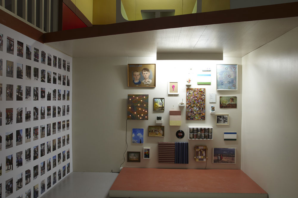 Installation: Several items have been hung on a gallery wall - they look as though they would be more at home in a teenager's bedroom.