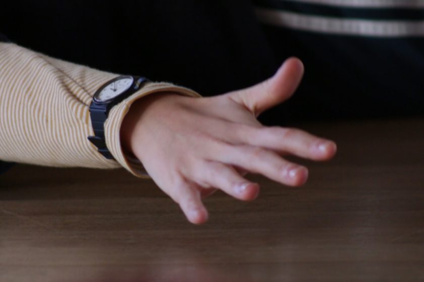 Film still: A stretched out hand