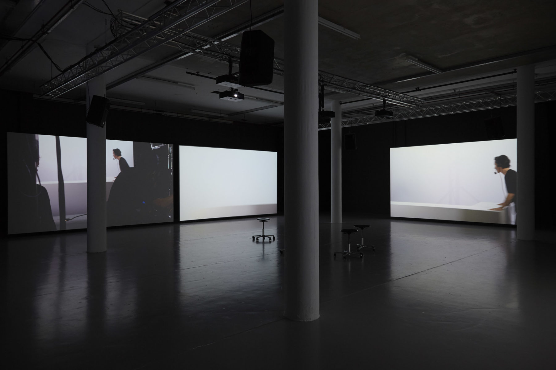 Three screens in the gallery - two have a set runner at work, moving set furniture around. The middle screen is entirely white.