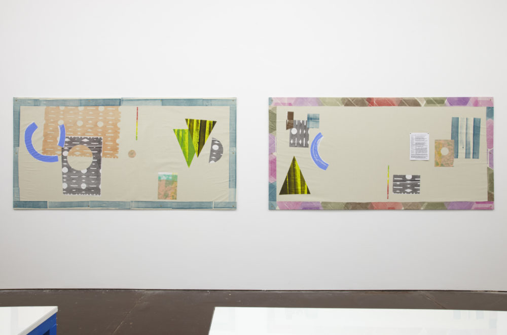 Installation view of Ciara Phillips and Corita Kent, Pull Everything Out (2012) A screen-printing press set up on a table next to screen prints on the wall.