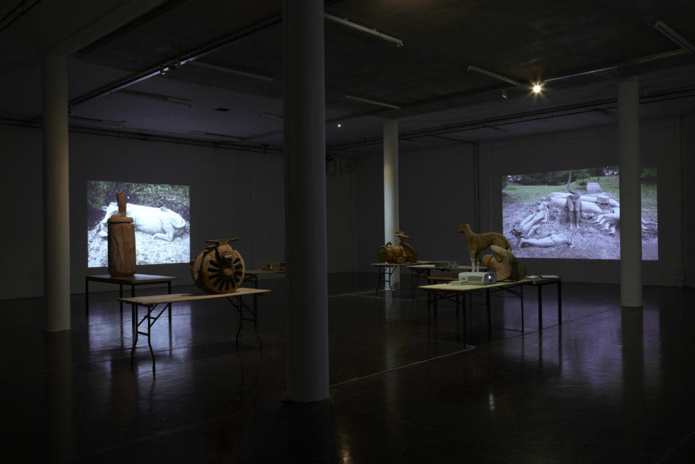 Installation view of Crêpe Suzette, (2012). Projections of outdoor sculptures are surrounded in the gallery by various wooden sculptures.