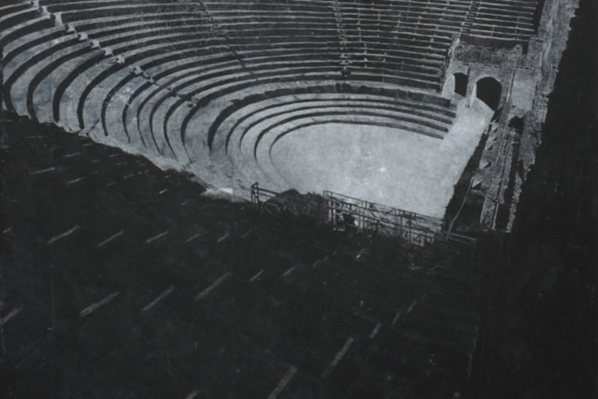 A print of a photograph of an amphitheater. The print is made from chalk on blackboard.
