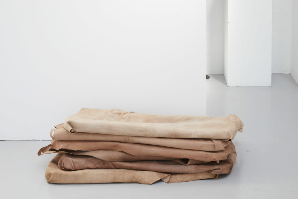 Harriet Bowman,Stacked leather moulds (obstruction) (2018) Moulded leather. Installation view, All Round-er (sad sale), Spike Island (2018) Photograph by Stuart Whipps