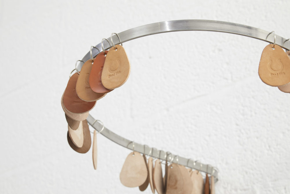 Harriet Bowman, Cheap Luck (500 keyrings) Hand-embossed leather, metal rings. Installation view, All Round-er (sad sale), Spike Island (2018) Photograph by Stuart Whipps