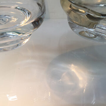 Two glass structures on perspex