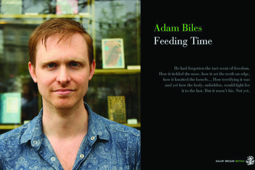 A photograph of the author Adam Biles next to their book Feeding Time.