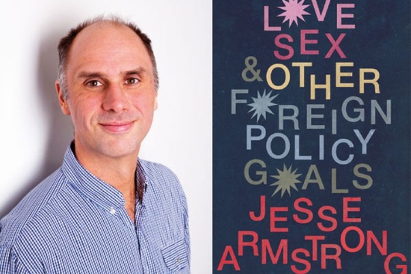 A photograph of the author Jesse Armstrong next to their book Love, Sex & Other Foreign Policy Goals.