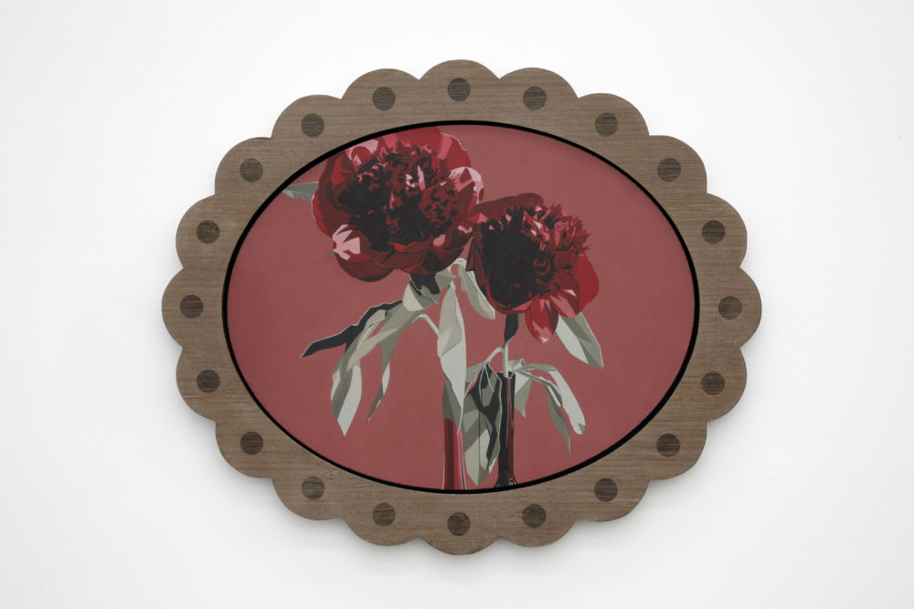 Installation view of Prophet (2008). A framed image of two roses.
