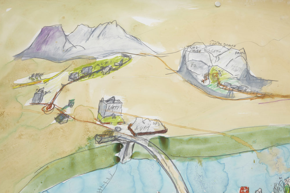 A hand drawn and painted map - two mountains are visible and a bridge over a river.