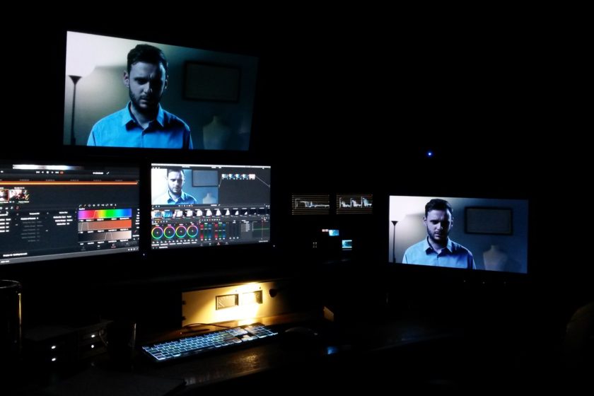 An edit suite shows several screens, digital tools and a keyboard.