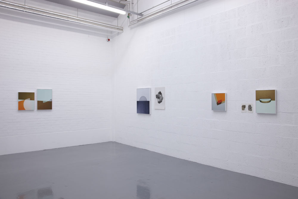 Installation view of Suzanne Mooney, The Edge of Collapse (2011). The gallery is painted white. Six graphic art images hang on the walls.