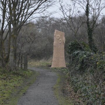 Image of wooden sculpture of a tree in a park