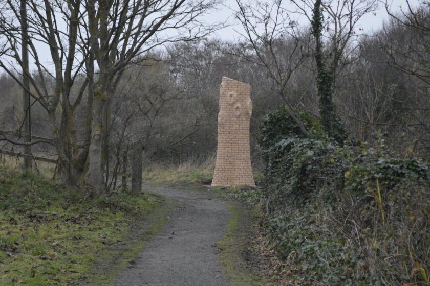 Image of wooden sculpture of a tree in a park
