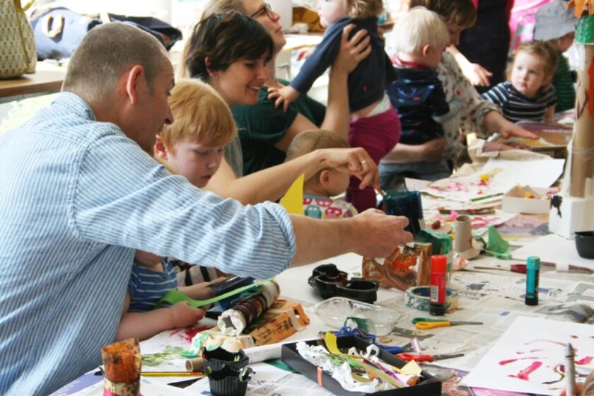 Young children and parents at a Baby Art Hour event