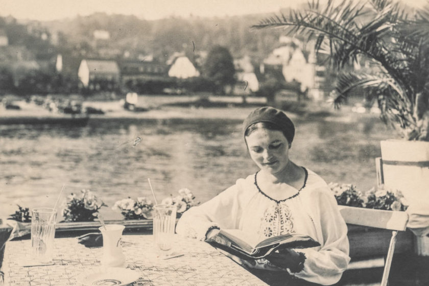 Woman reading a book outside. Zelda Fitzgerald event at Spike Island, Bristol