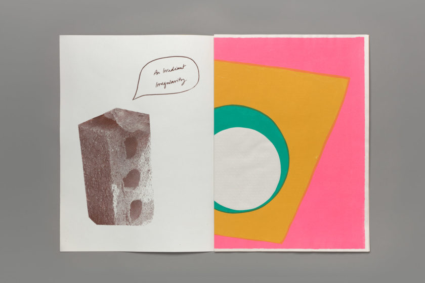 An open book. On the left page is a risographed and pixelated image of a brick with a hand-drawn speech bubble coming out of it with the words “An Irradient Irregularity” written inside it, in cursive. On the right hand page is a colourful abstract print; a white circle on top of a teal circle, on top of a cropped yellow square on a pink background.