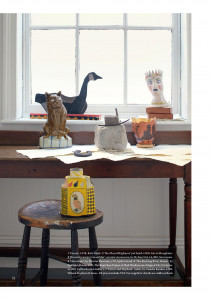 Inside page of The World of Interiors magazine, featuring a variety of artists' editions displayed on table tops and a windowsill in a well lit room