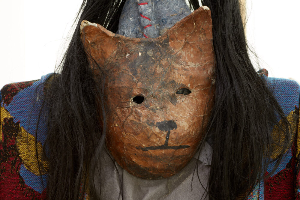 Close up of a glazed ceramic mask.