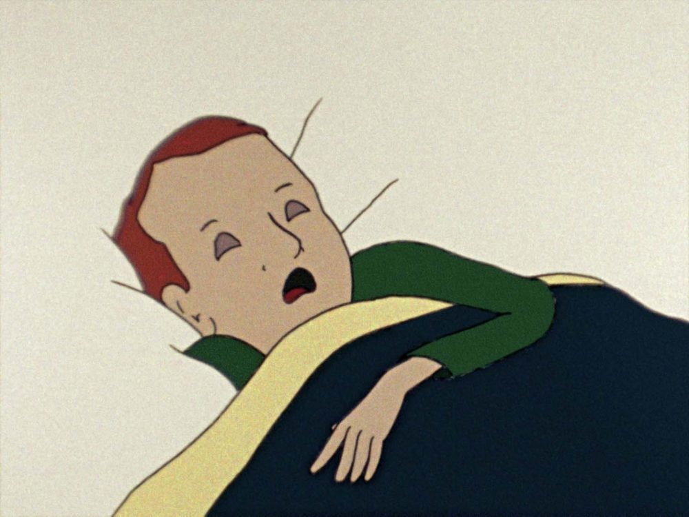 Film still of a cartoon character sleeping in bed. Their eyes are closed and their mouth is open, one arm is sticking outside of the navy blue bedsheet.