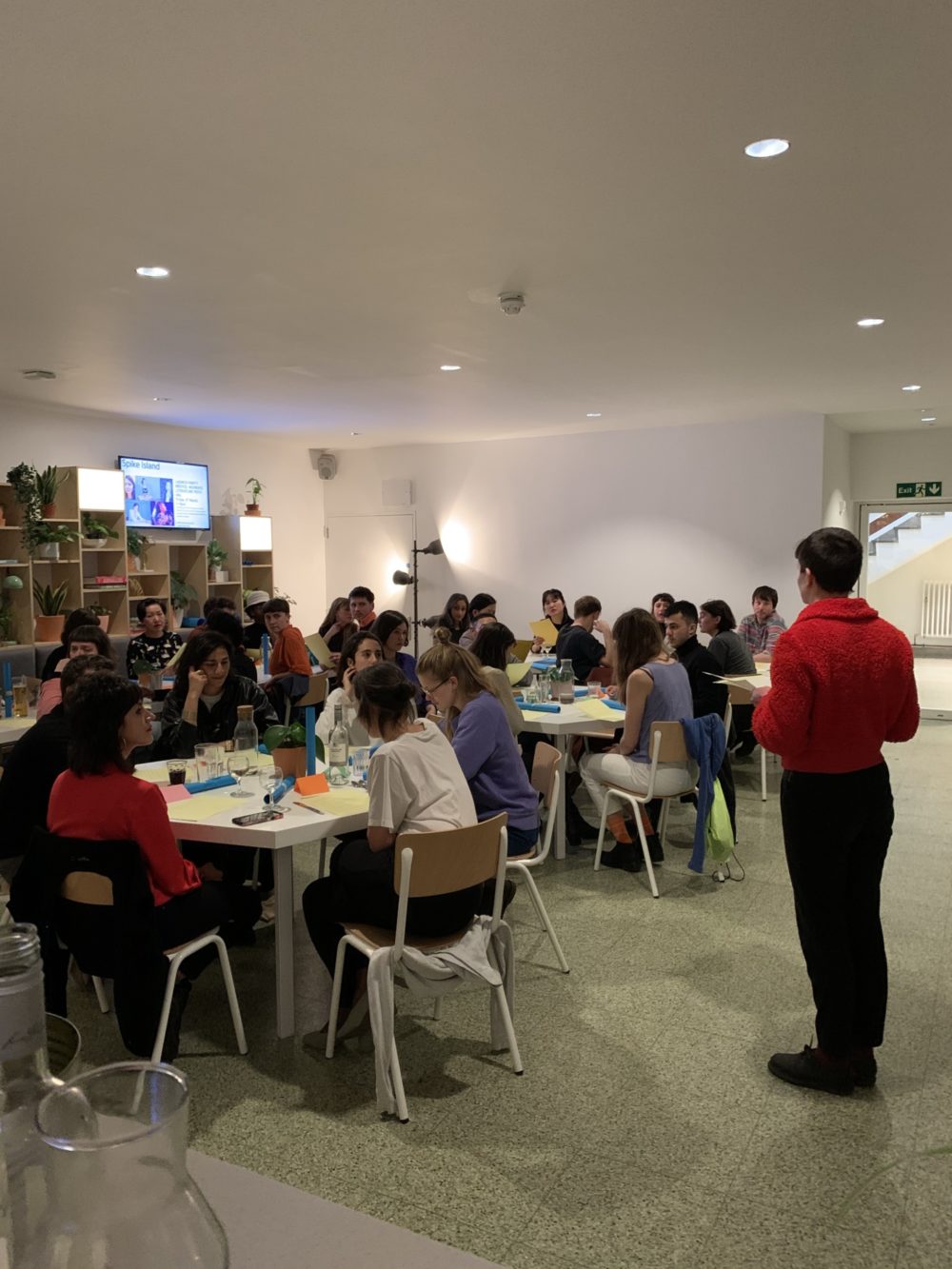 The participants in the Spike Island Café - one appears to be addressing the room.