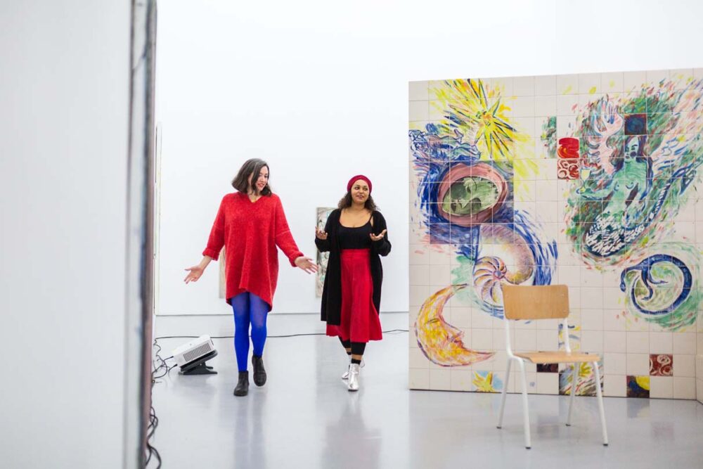 Photograph of Lucy Stein and Maria Christoforidou Performing the Question in the exhibition Wet Room at Spike Island