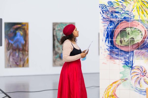 Photograph of Lucy Stein and Maria Christoforidou Performing the Question in the exhibition Wet Room at Spike Island