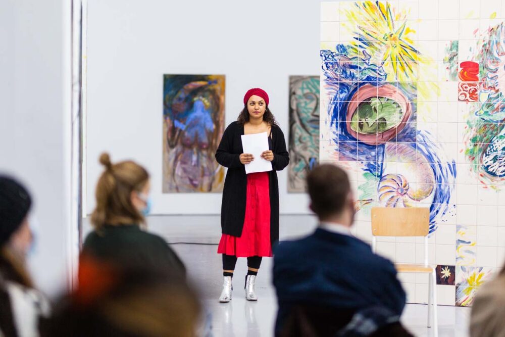 Photograph of Lucy Stein and Maria Christoforidou Performing the Question in the exhibition Wet Room at Spike Island