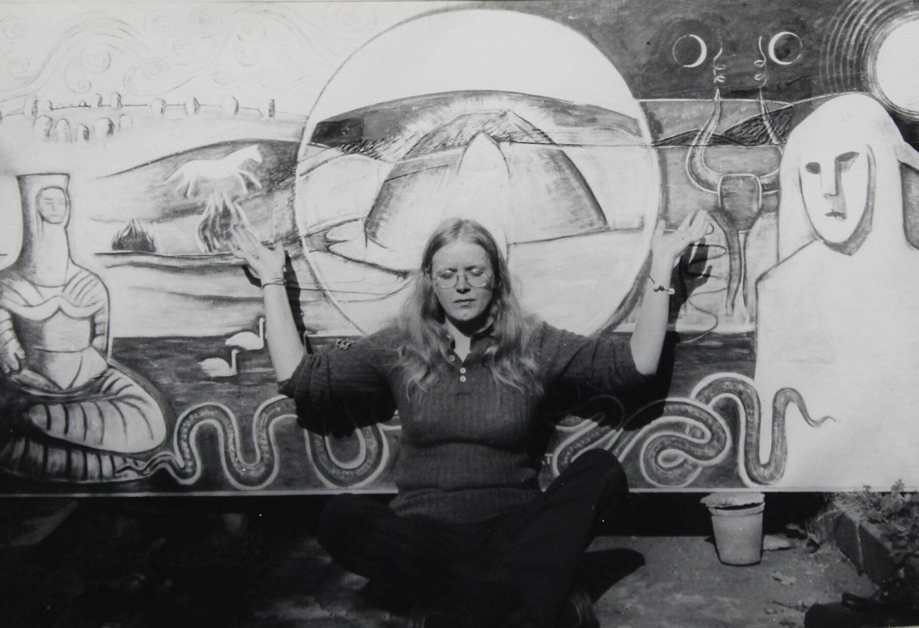 A photograph of Monica Sjöö in front of Goddess at Avebury, painted following her ‘initiation’ at Silbury Hill, 1978