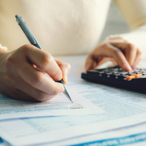 Close-up of woman filling out forms