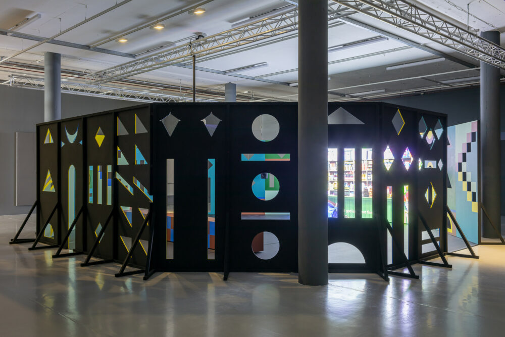 A a pavilion with different shaped cut outs in Spike Island's gallery.