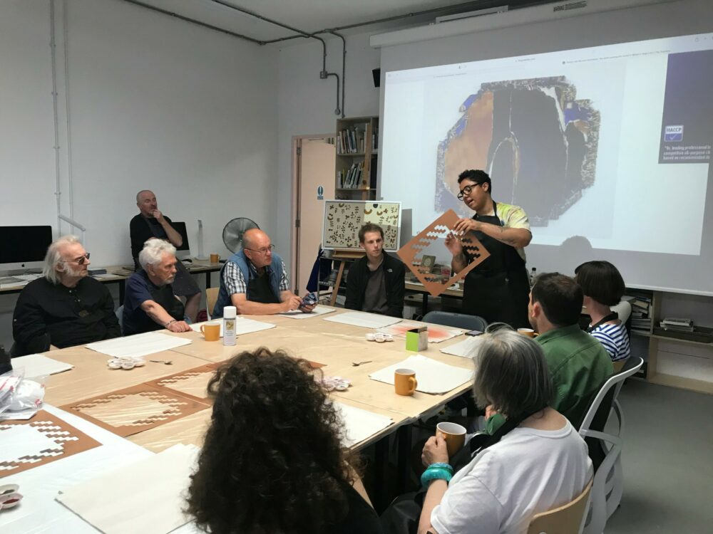 Photograph of artist Tanoa Sasraku leading a workshop.