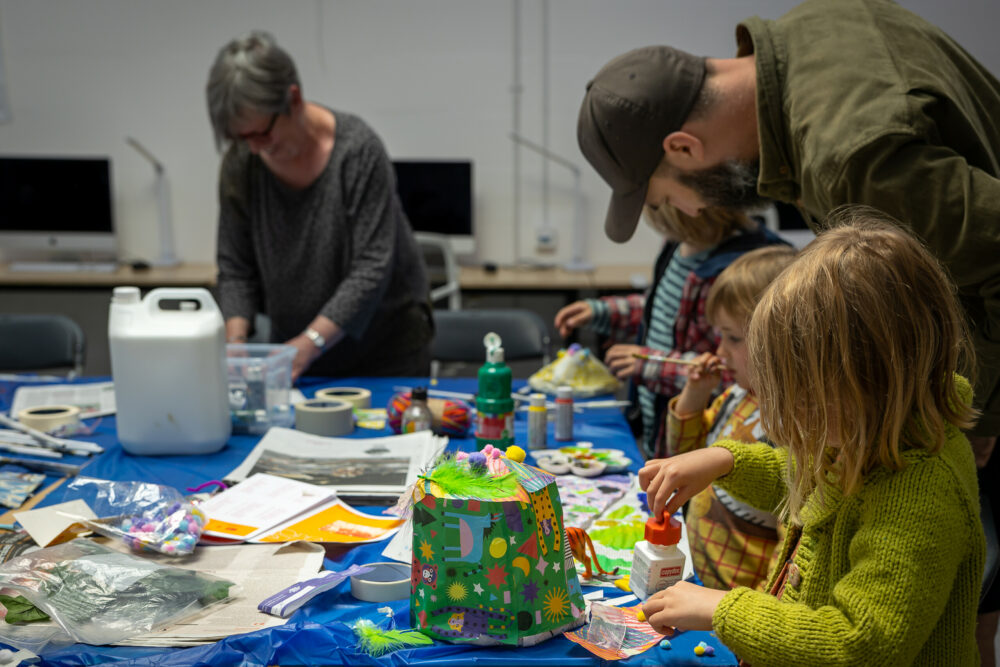 A photograph of a crafting workshop for children.