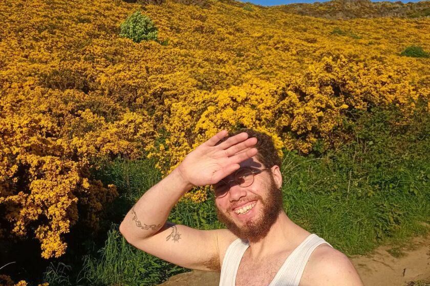 Image of Caspar Heinemann outside in a field on a sunny day.