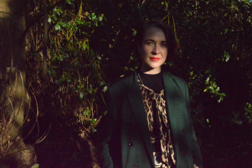 A portrait of Florence Fitzgerald-Allsopp standing amongst trees